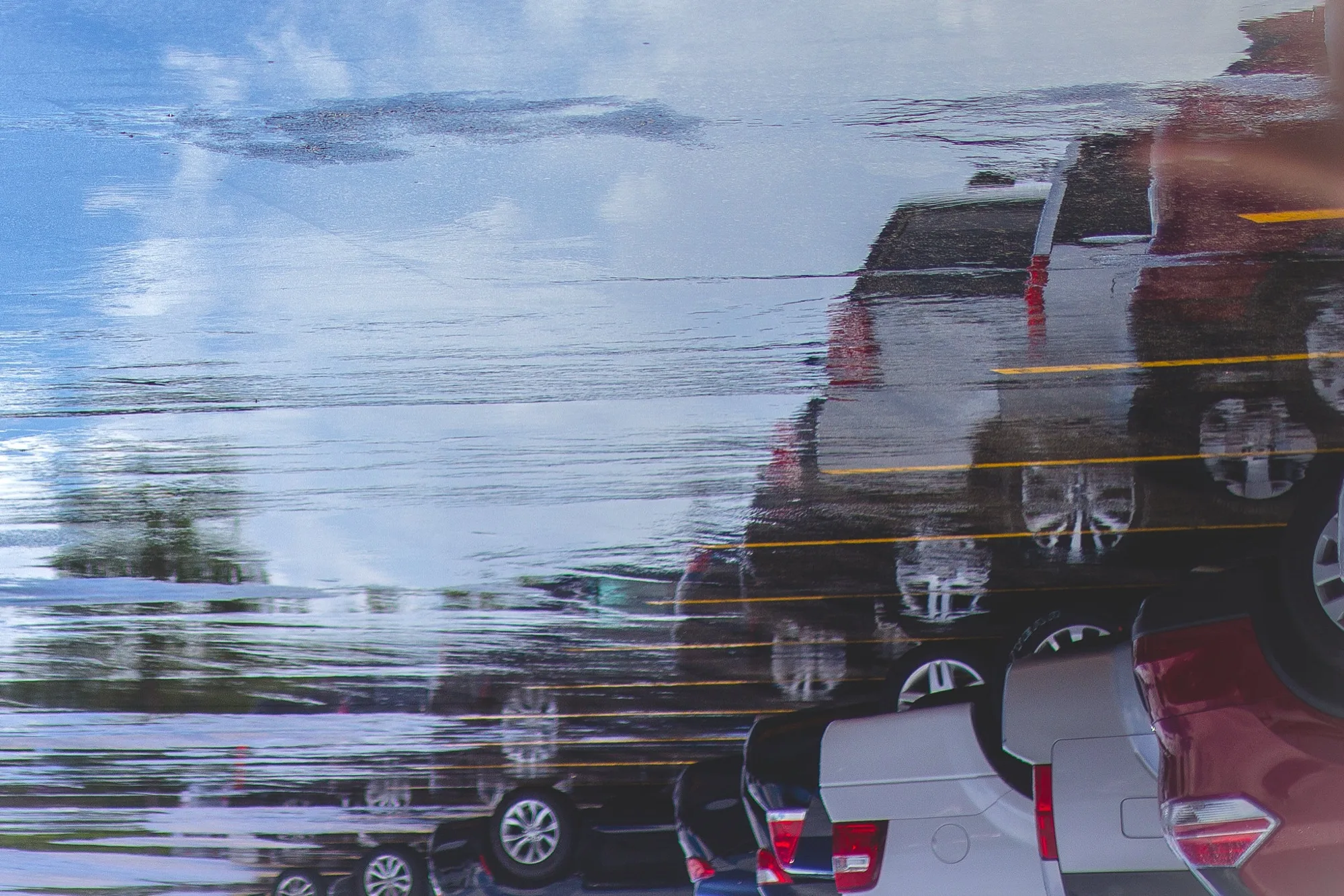 Cars in a puddle. Misc photography by Robin Mehdee, South Florida.